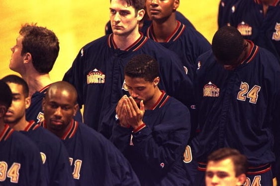 Mahmoud Abdul-Rauf praying during the national anthem