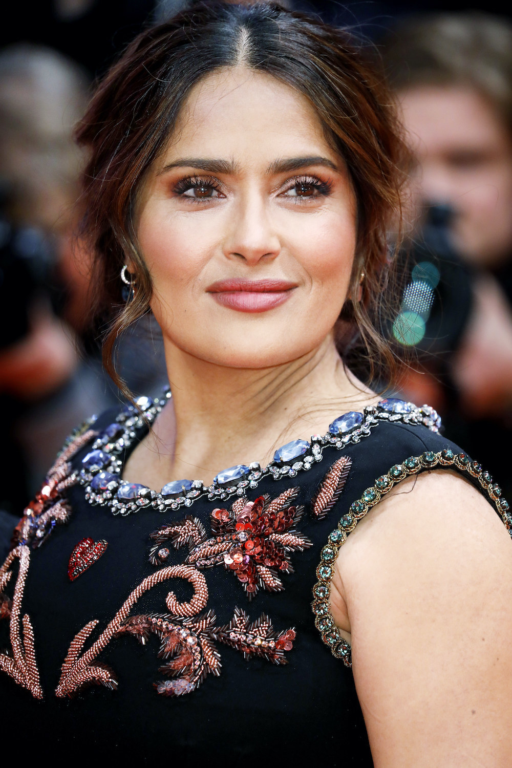 Salma Hayek wears a dress with a jeweled collar for the premiere of The Roads Not Taken at the Berlin Film Festival 