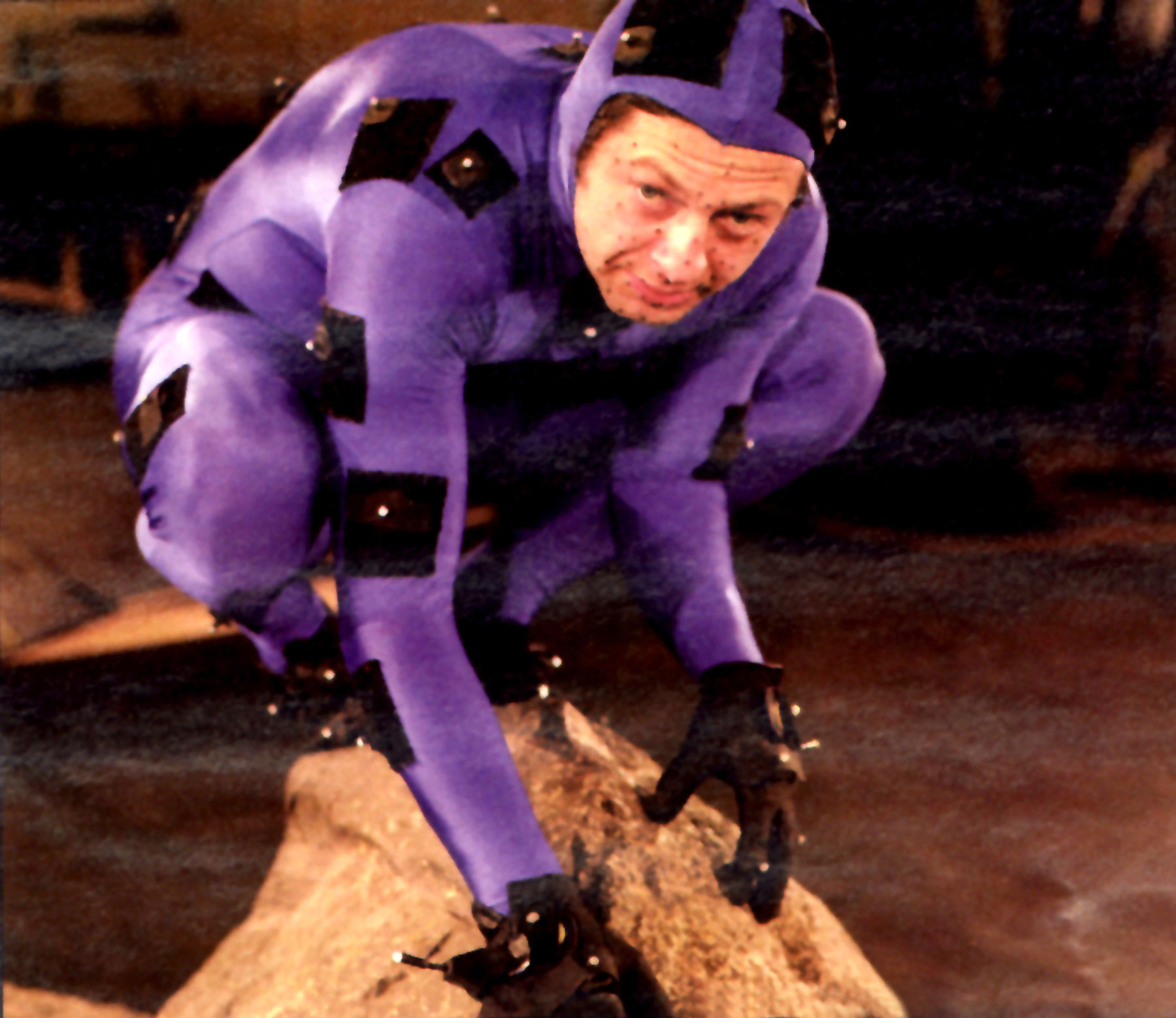 Andy Serkis crouching as Gollum in a morph suit