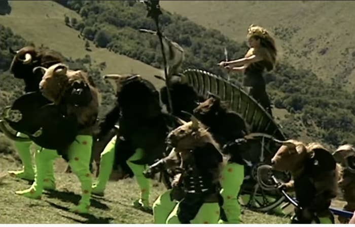 still from the first chronicles of Narnia with people with green tights and horned masks and furry tops