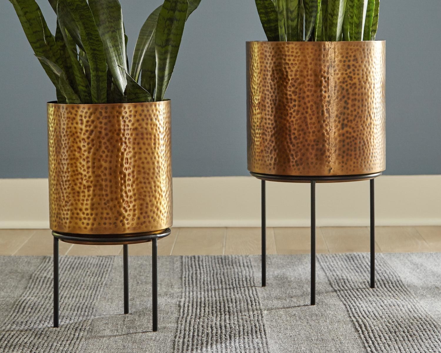 Two antique brass, hammered planters on stands