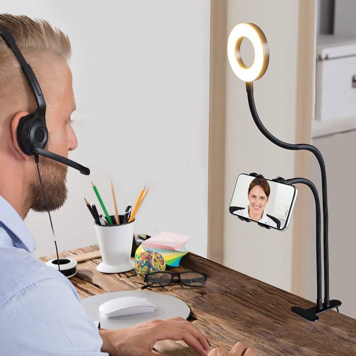 A person using the phone ring light stand 