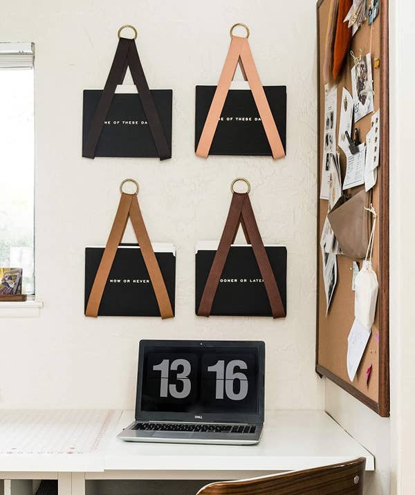 four leather file holders in black, tan, walnut, and mahogony