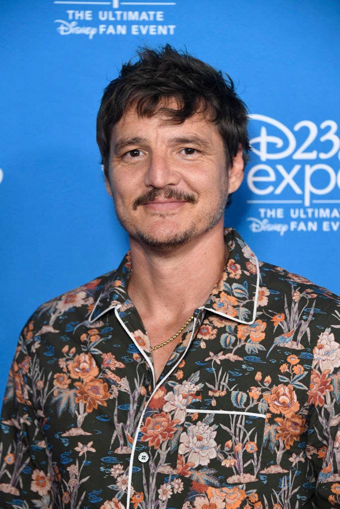 Pedro wearing a floral print shirt at an event