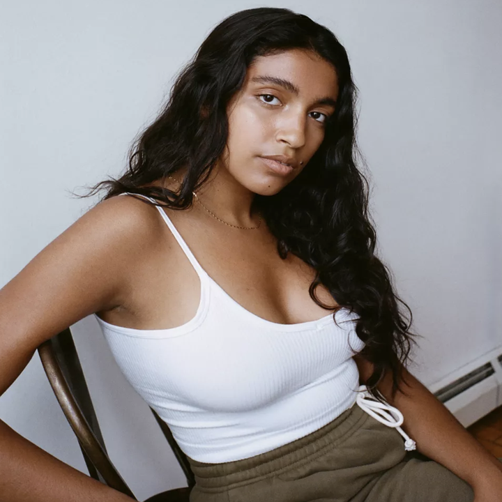 model wearing the white tank 