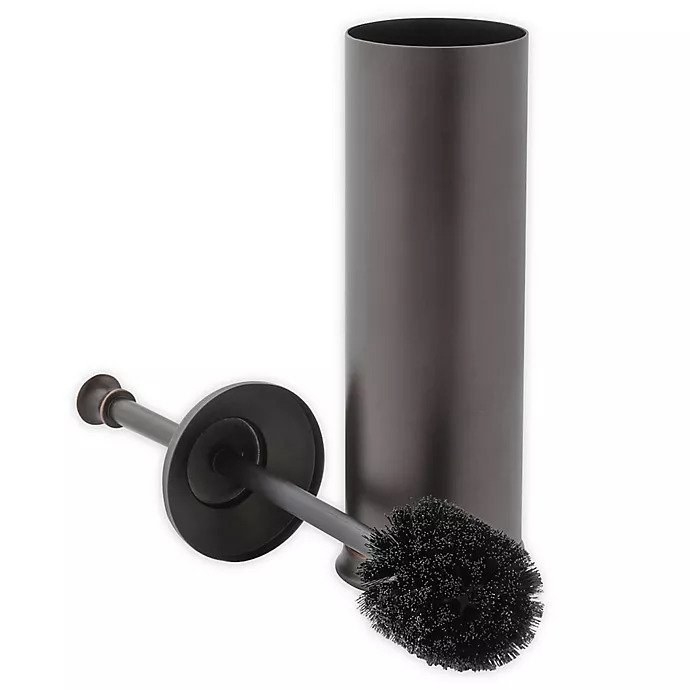 toilet brush in oil rubbed bronze with black bristles next to its cylindrical holder; the lid for the holder is halfway up the toilet brush&#x27;s stick 