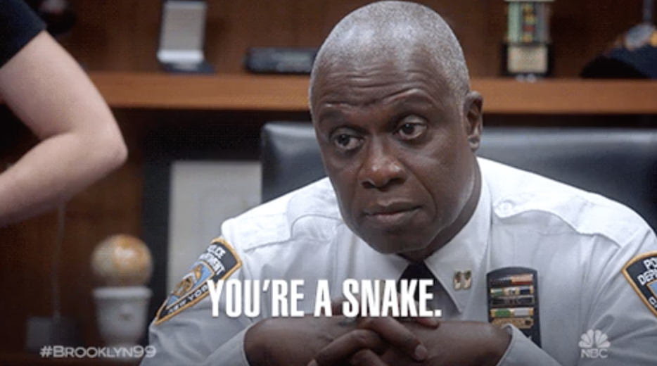 Captain Holt from &quot;Brooklyn Nine-Nine&quot; sitting at his desk, telling someone: &quot;You&#x27;re a snake&quot;