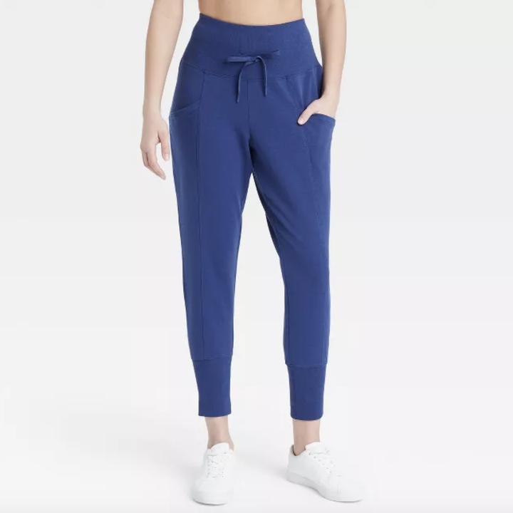 model wearing the royal blue high waisted joggers