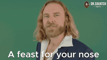A gif of a person looking into the camera and saying a feast for your nose