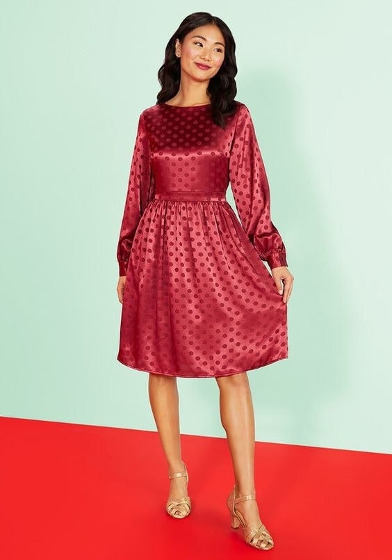 Model in the red polka dot dress