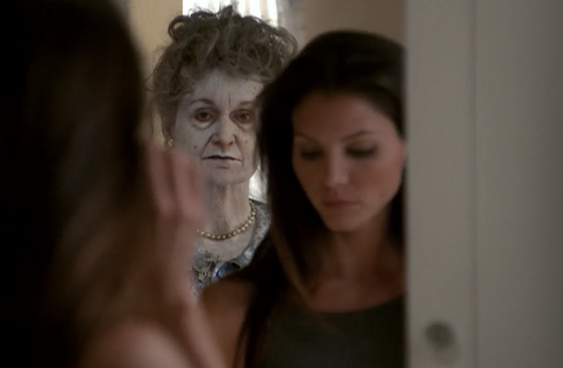 In Angel, Cordelia looks down and a ghost appears in the mirror