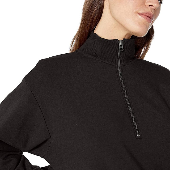 model wearing the black sweater 