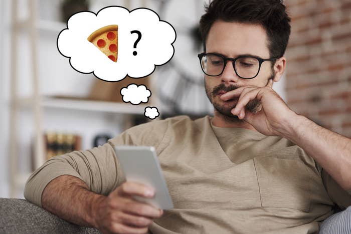 A stock photo of a guy thinking while texting next to a thought bubble that has a pizza emoji and a question mark