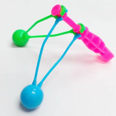 A lime green, neon blue, and neon pink clacker