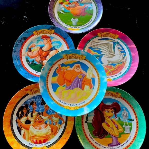 A set of six different Hercules plates with the characters on them