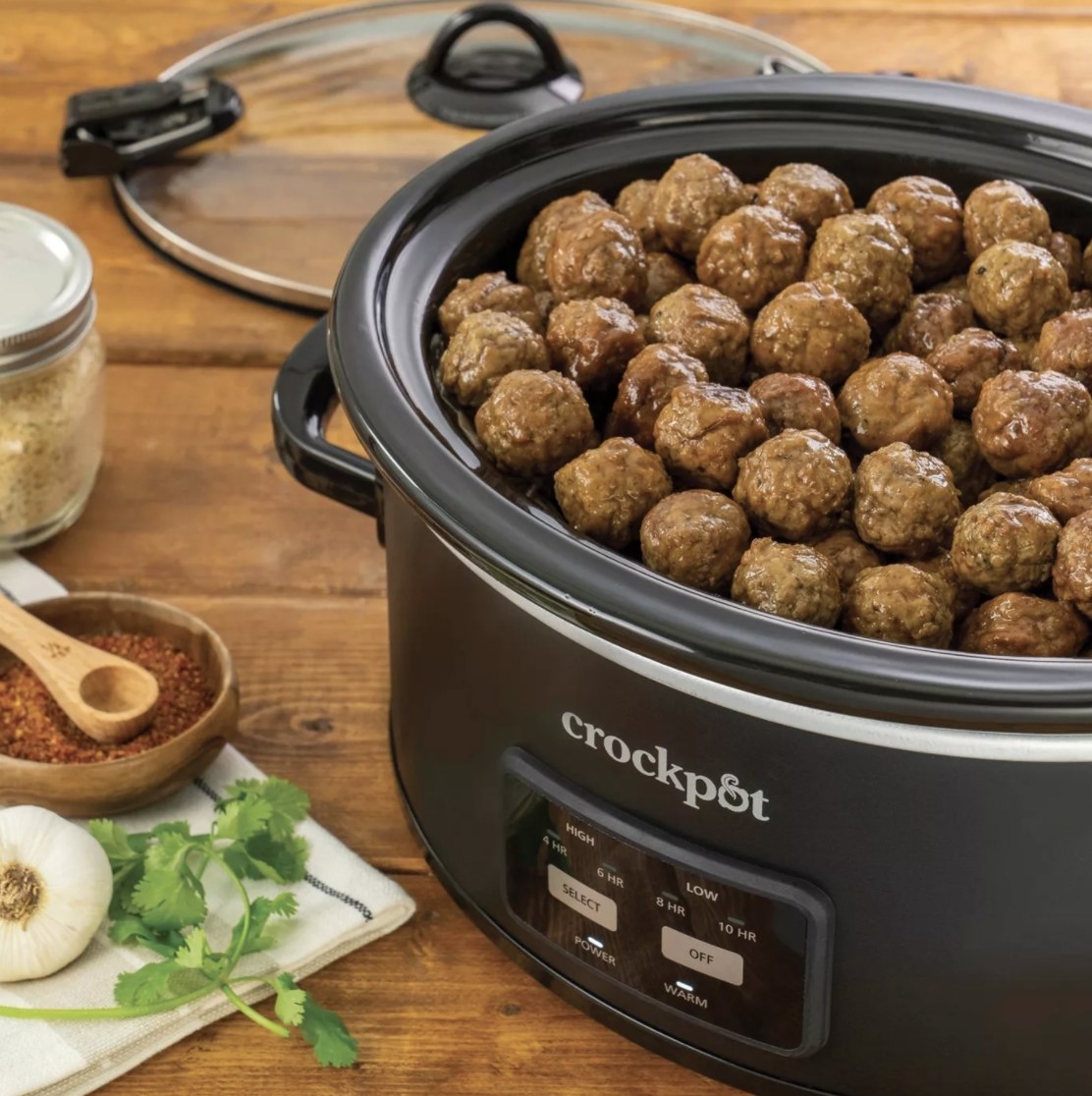 the crock pot with meatballs inside