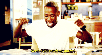 a gif of winston from new girl saying &quot;never EVER touch my puzzle!&quot;