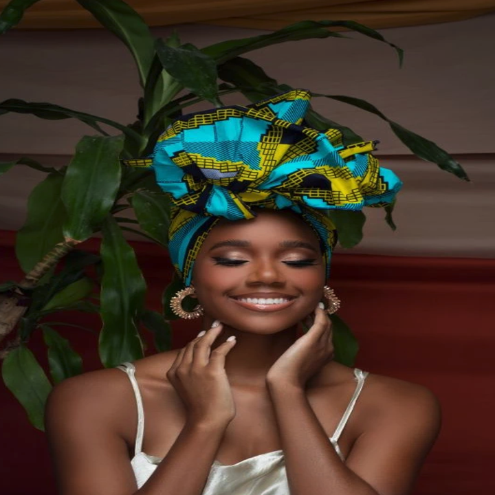 model waring a teal and blue head wrap
