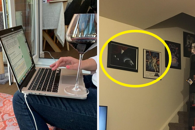 A wine glass sitting on a computer and two pictures hung up incorrectly