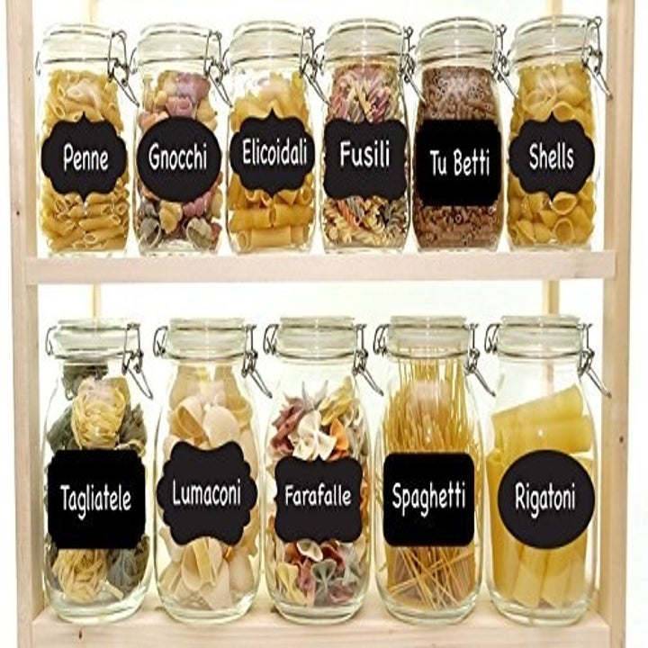 A set of black chalkboard stickers on jars of pasta