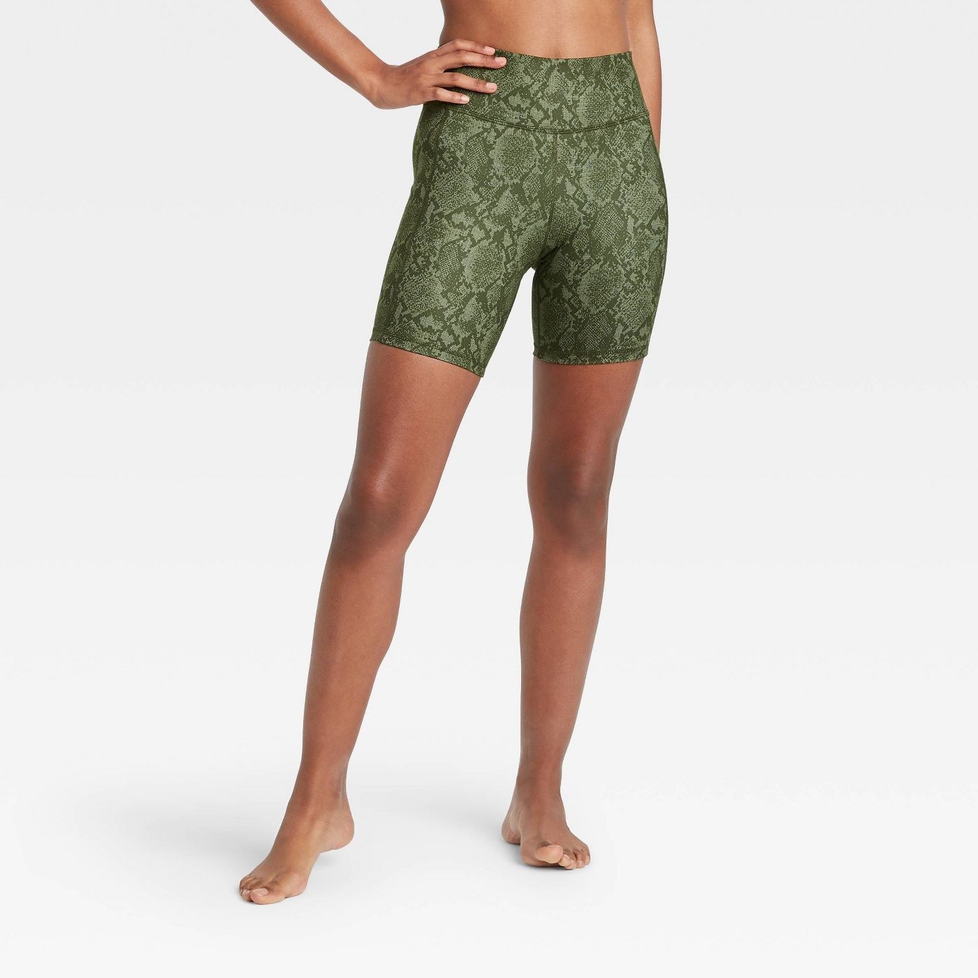 Model in high waisted snakeskin shorts