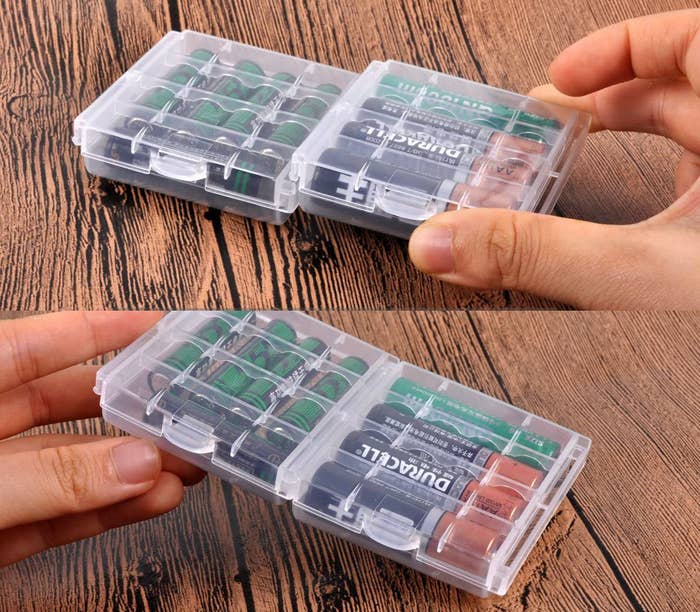 Two square plastic storage cases filled with batteries