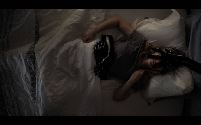 Madison Iseman as Rain Burroughs being consumed by gloved hands in "Fear of Rain."