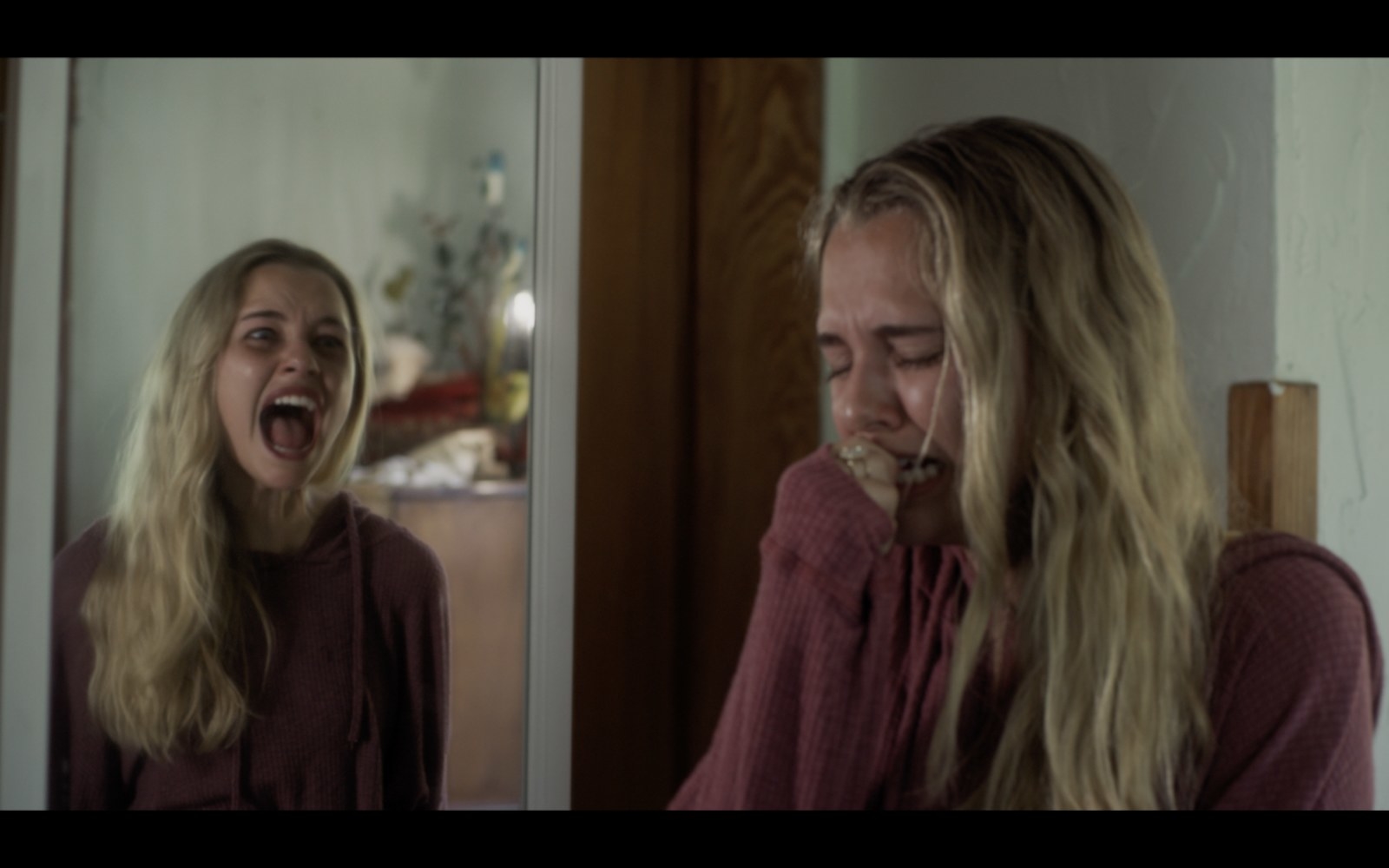 Rain (Madison Iseman) fears her mirror image, which mocks her.