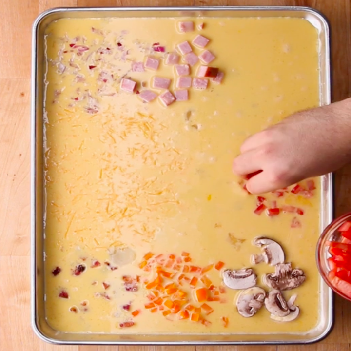 Preparing sheet pan eggs.