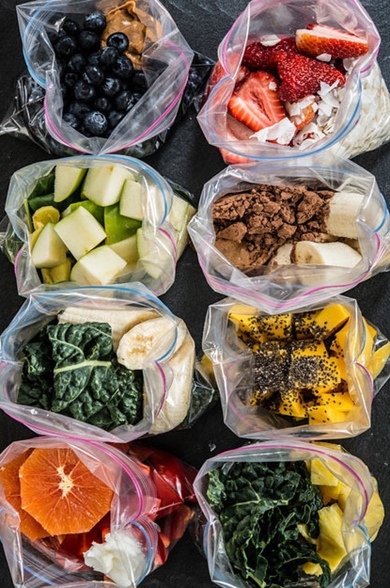 Frozen smoothie packs containing fruits and veggies.
