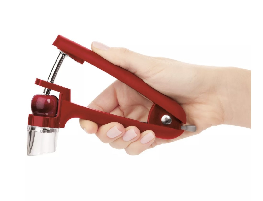 the cherry and olive pitter in red 