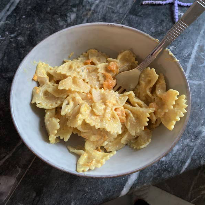 Creamy bowtie pasta in a bowl.