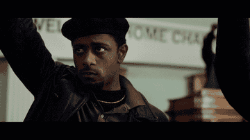 LaKeith Stanfield as William O&#x27;Neal at a Black Panther Party rally