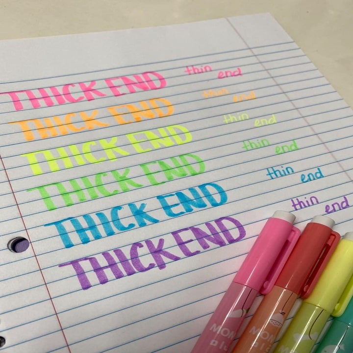 the thick and thin sides of the markers demonstrated through writing size; reviewer wrote out "thick end" where color looks thick and "thin end" where color looks thin