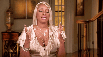 Nene Leaks takes a deep breath and balls her hands into fists to calm down in her confessional on Real Housewives of Atlanta