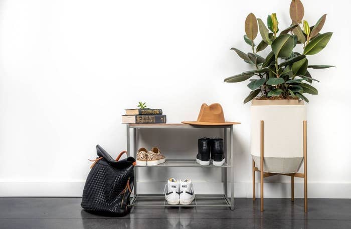 The three-tier rack holding shoes