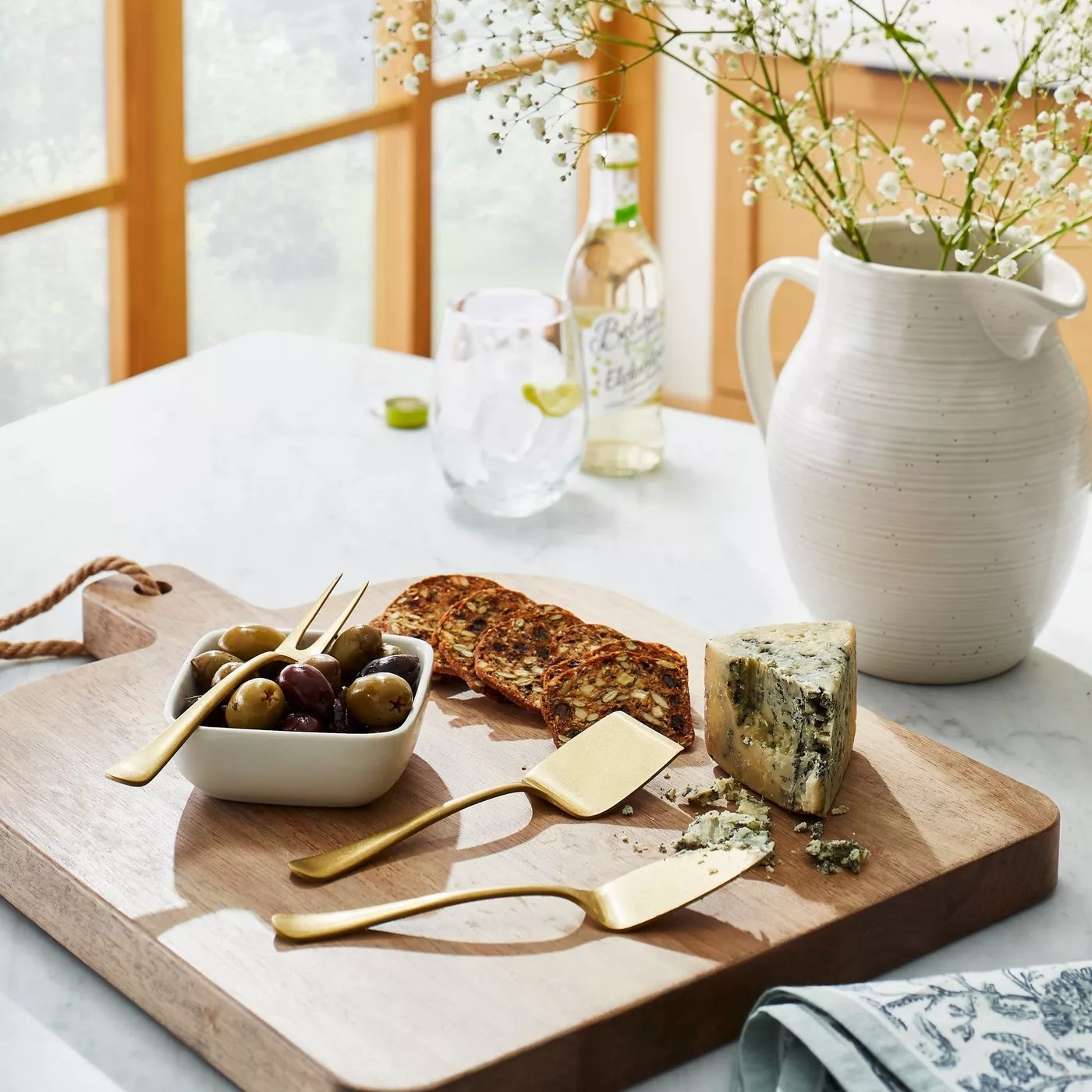 cheese knives and tray on counter