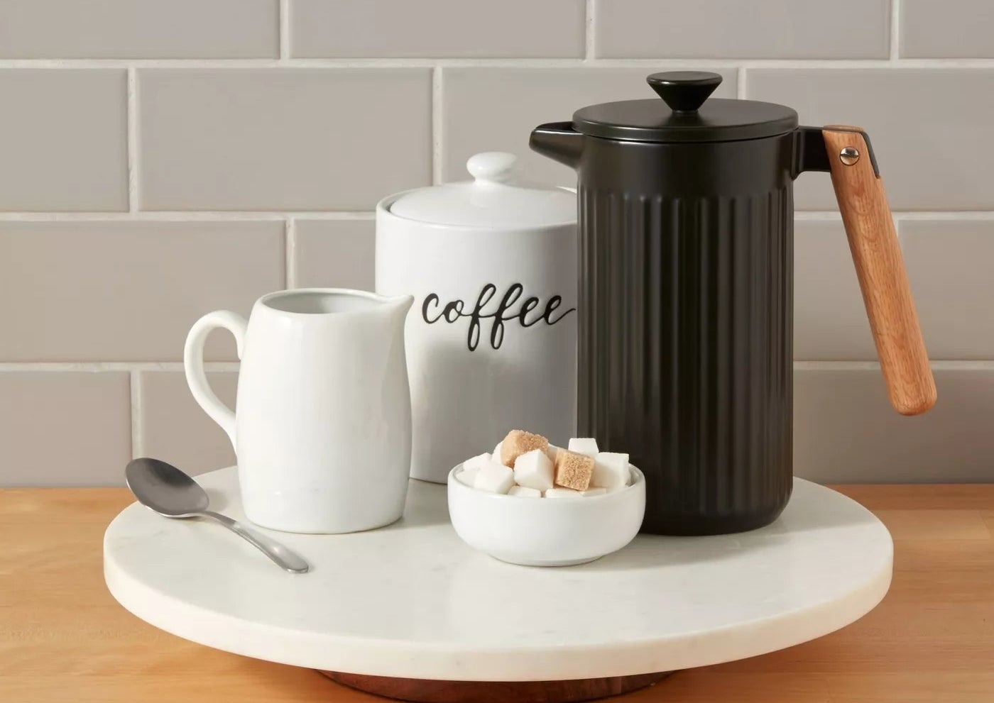 lazy susan with coffee mug and carafe on counter