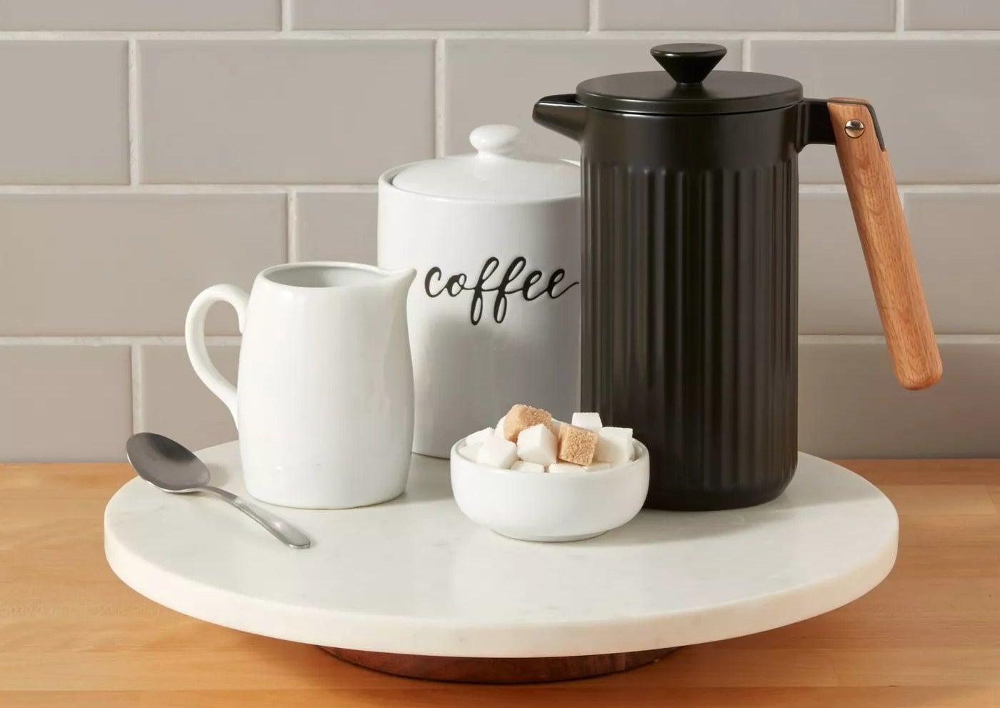 lazy susan with coffee mug and carafe on counter