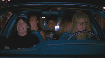 Wayne, Garth and friends headbanging in the car in Wayne&#x27;s World