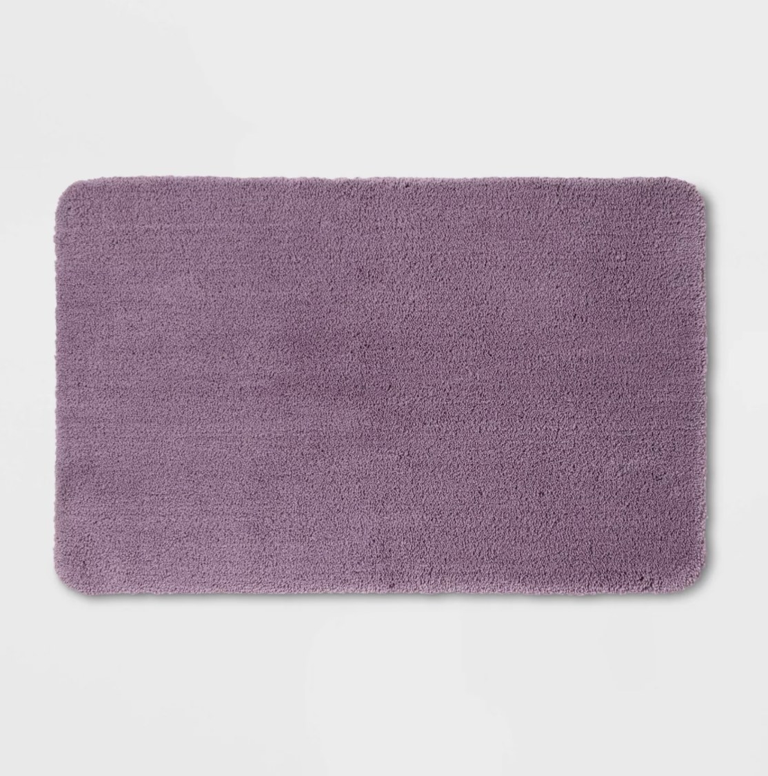 a purple plush bath mat
