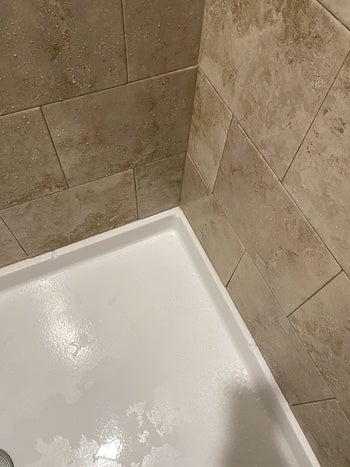 Reviewer photo of same shower after cleaning with mold and mildew remover