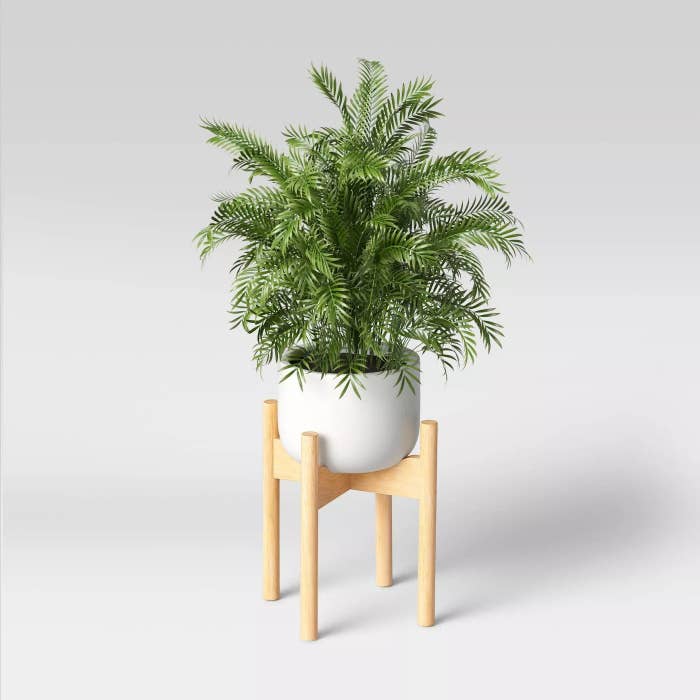 The planter with a potted plant