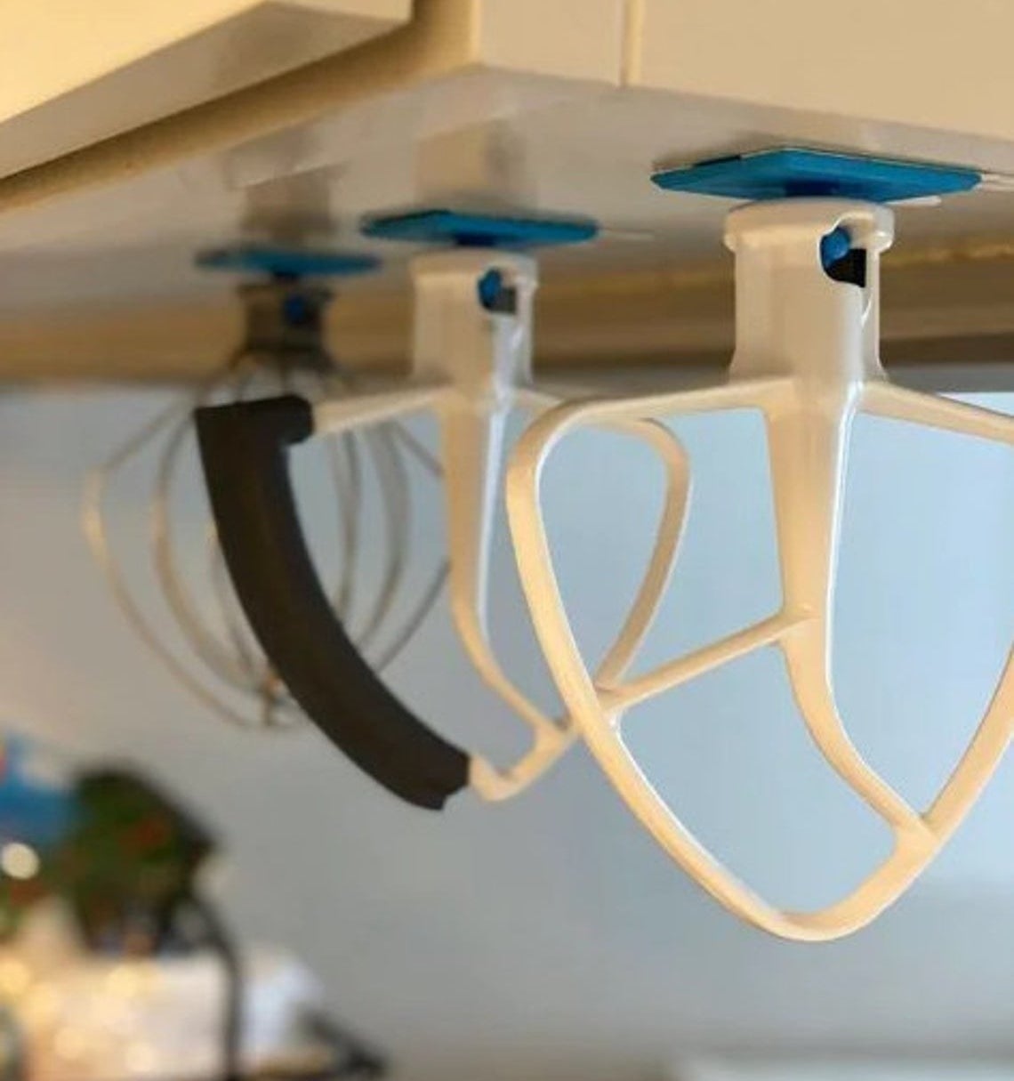 KitchenAid Tool Holder set placed on the bottom of a cabinet