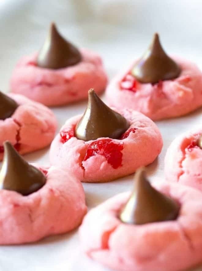 Cherry cookies with chocolate kisses.