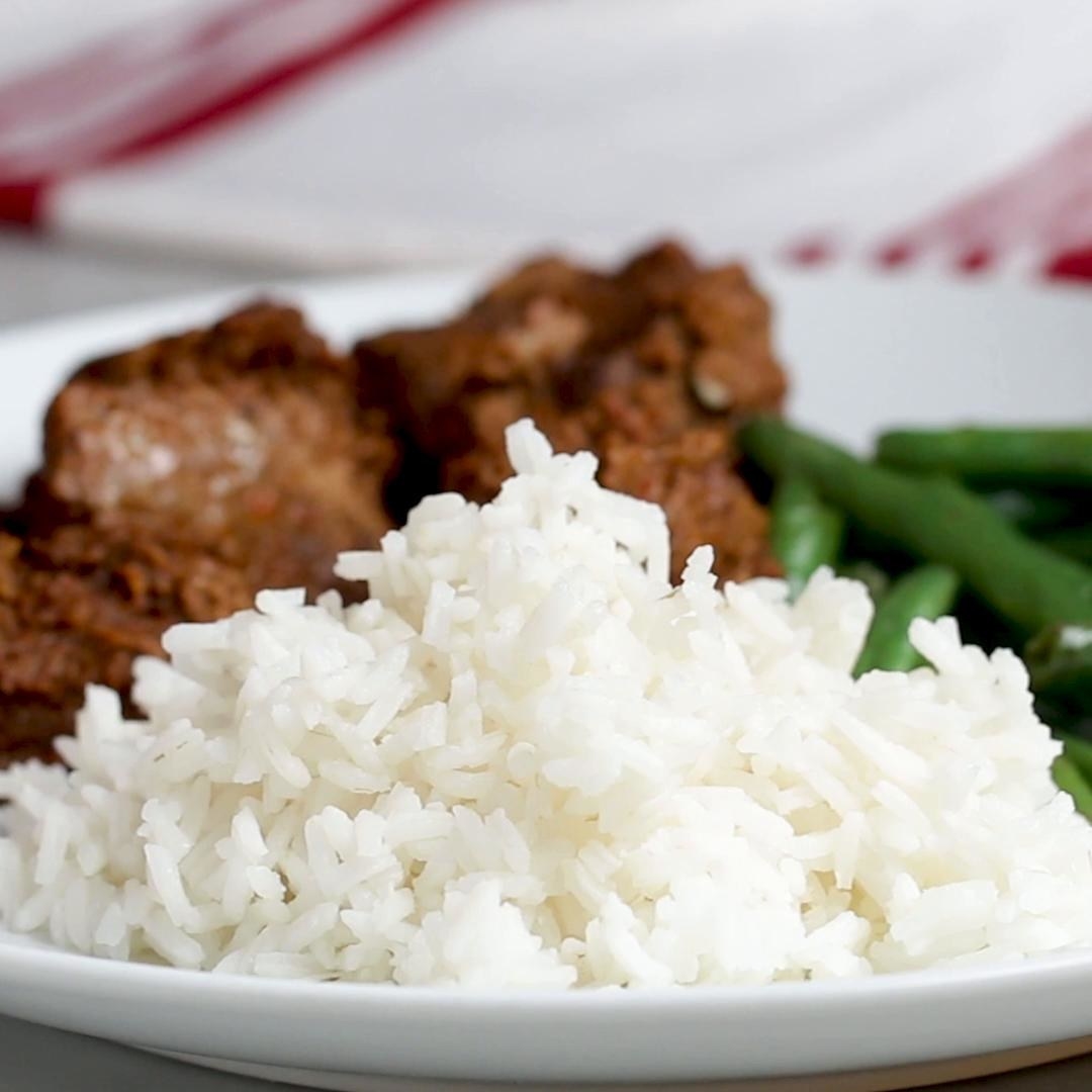 White rice on a plate with meat and vegetables