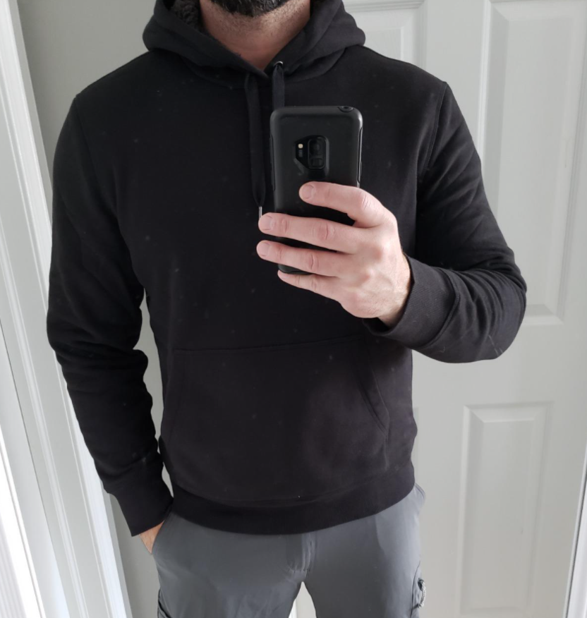 A reviewer wearing the hoodie