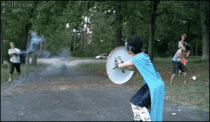 Kid dressed as Captain America getting pelted with a firework