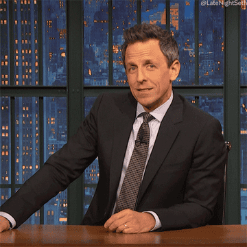 Seth Meyers purses his lips and tilts his head in a &quot;guess so&quot; gesture on Late Night with Seth Meyers