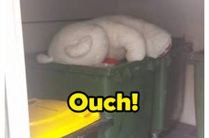 A giant teddy bear is in the trash